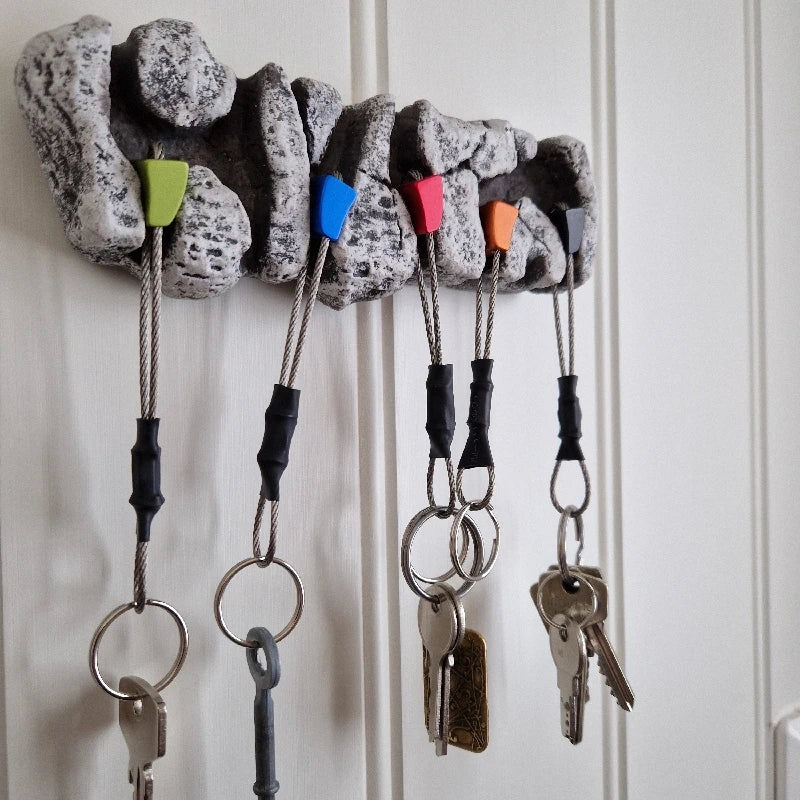 close up of large rock key holder with keys buy