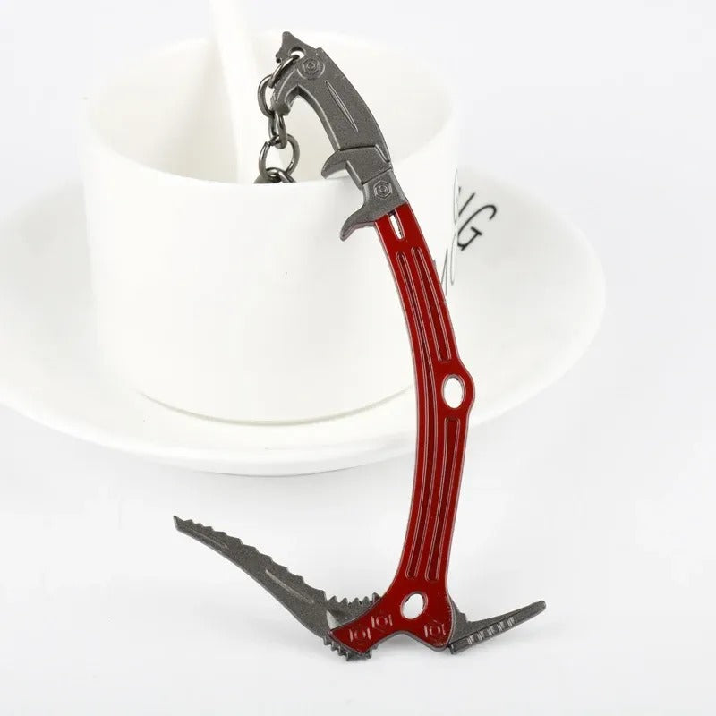 ice pick keychain next to climbing gear