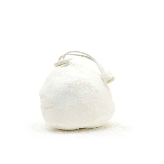 refillable chalk ball next to climbing gear