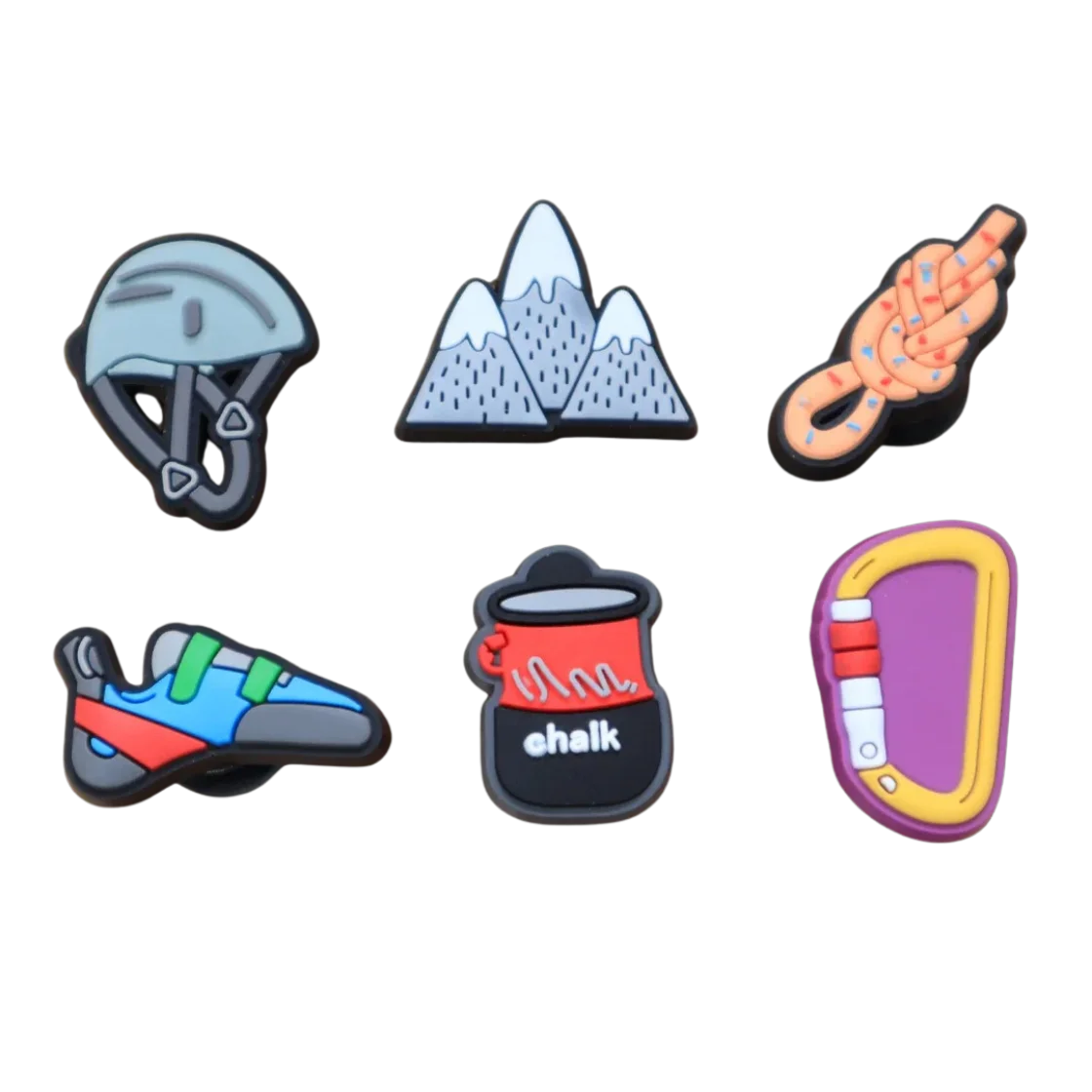 rock climbing shoe charms 6 pcs next to hiking gear