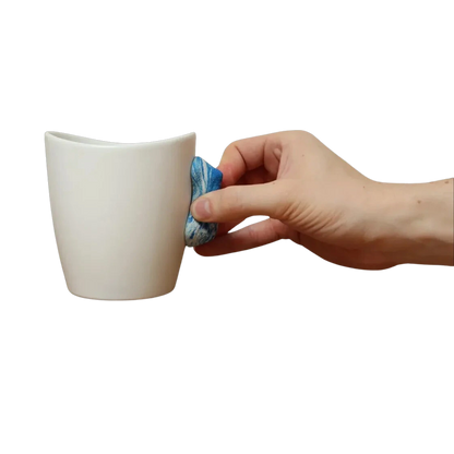 blue and white handle rock climbing mug