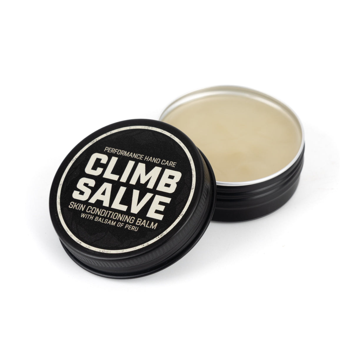 Angled view of the open Climb Salve tin and lid
