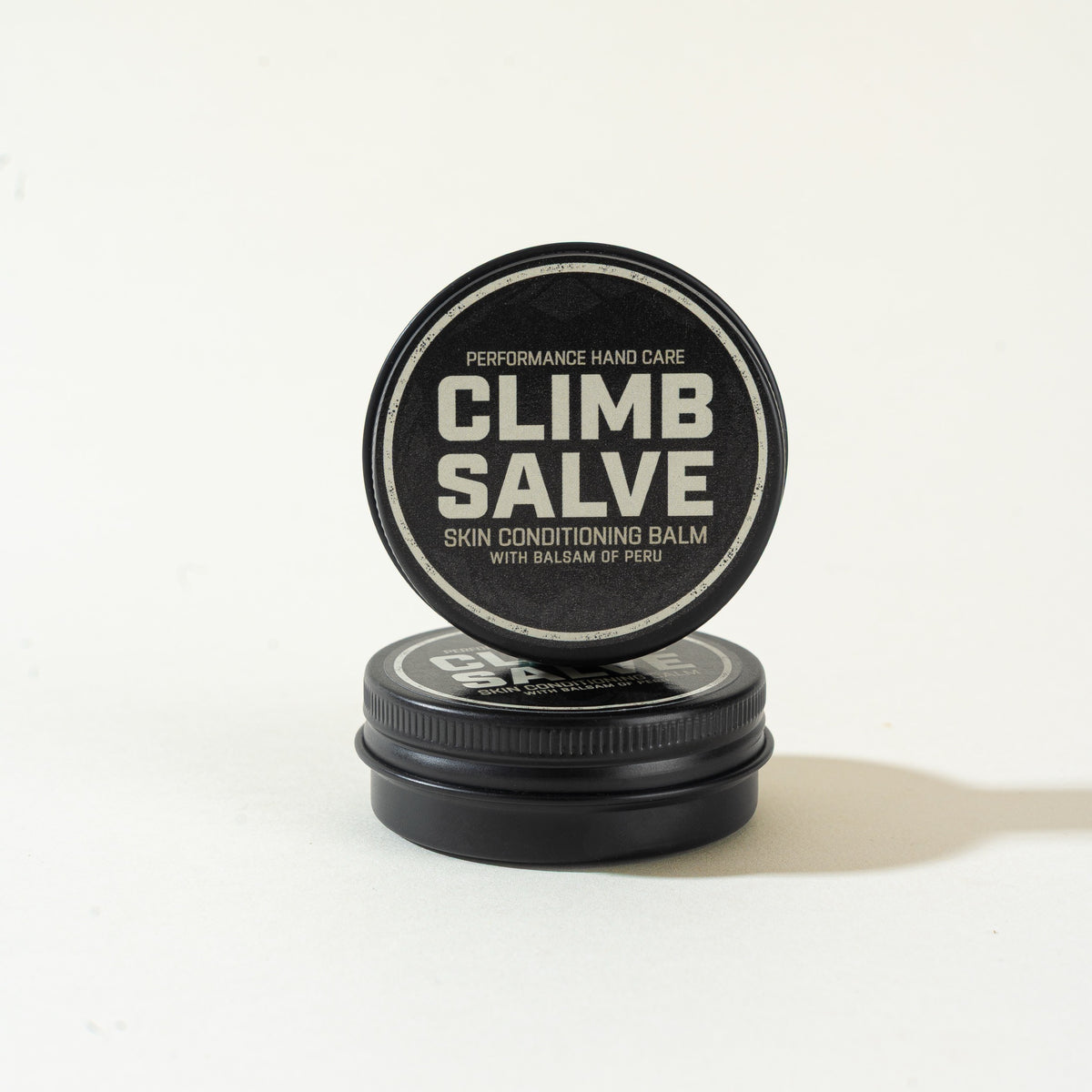 Closed Climb Salve tin with a lid displayed upright