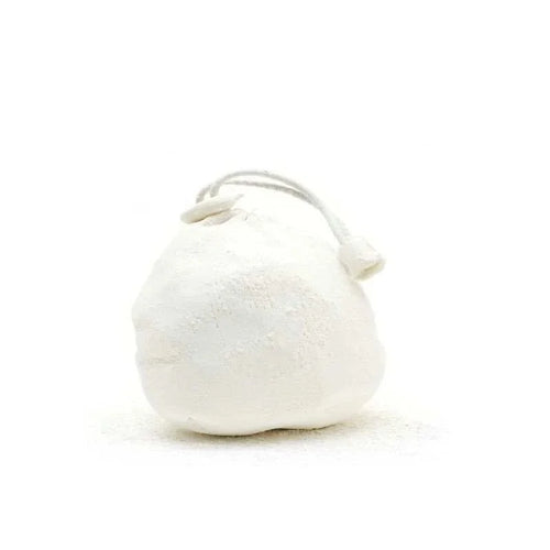 refillable chalk ball next to climbing gear