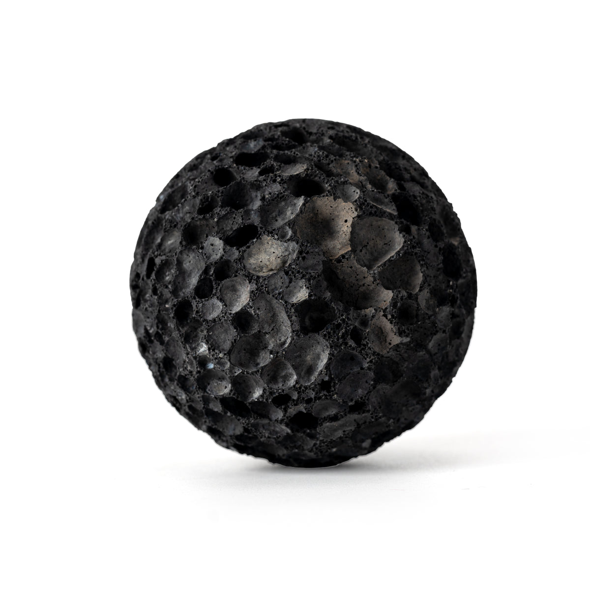 RHINO BALL natural volcanic stone on a white background