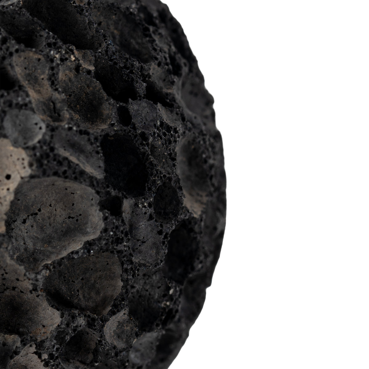 Close-up of the RHINO BALL porous volcanic stone texture