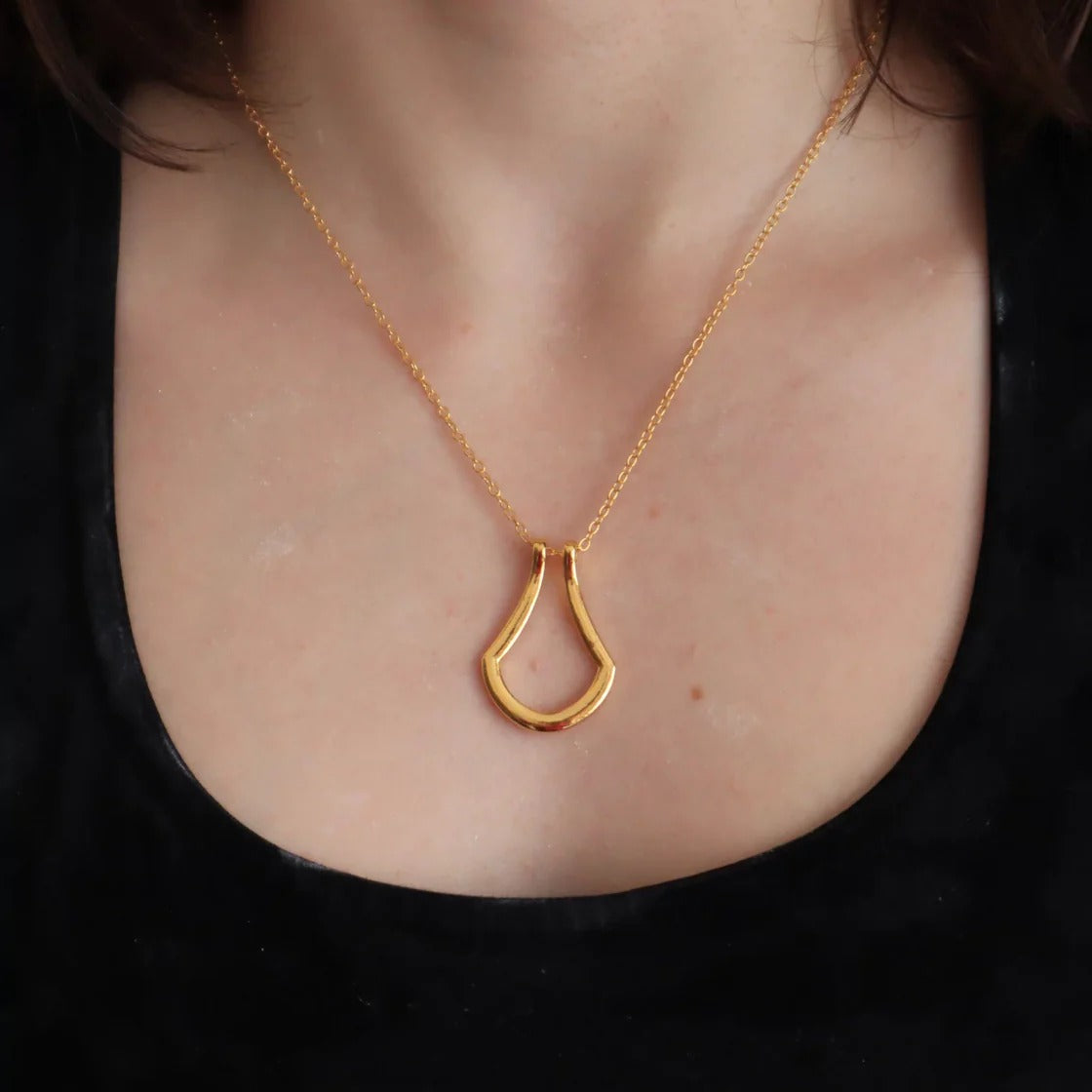 rock climbing necklace featuring aring holder
