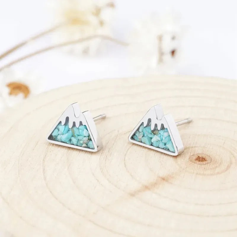 side view of turquoise howlite mountain stud earrings
