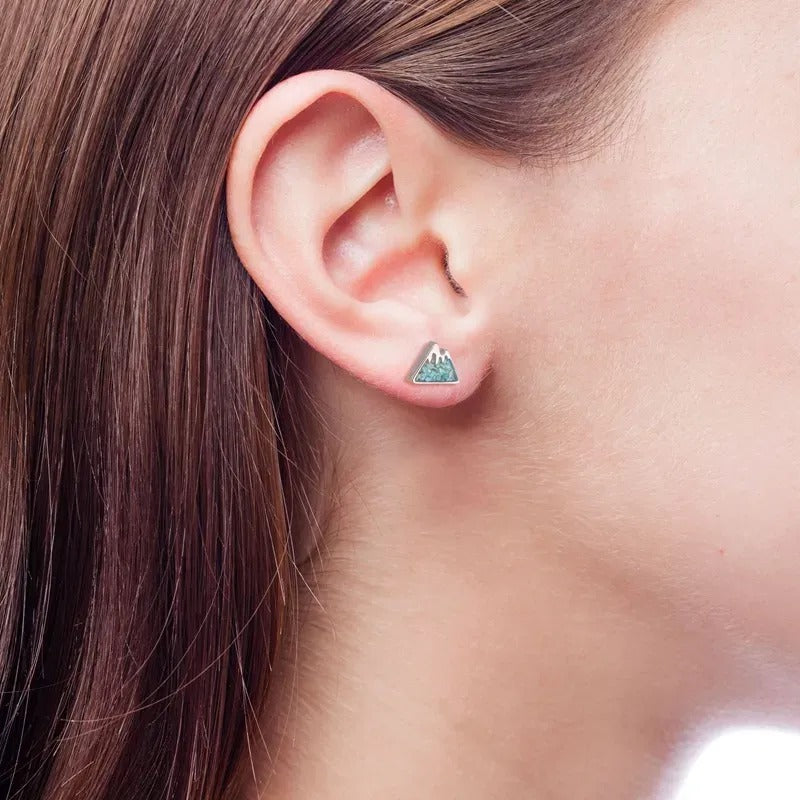 turquoise howlite mountain stud earrings on white background