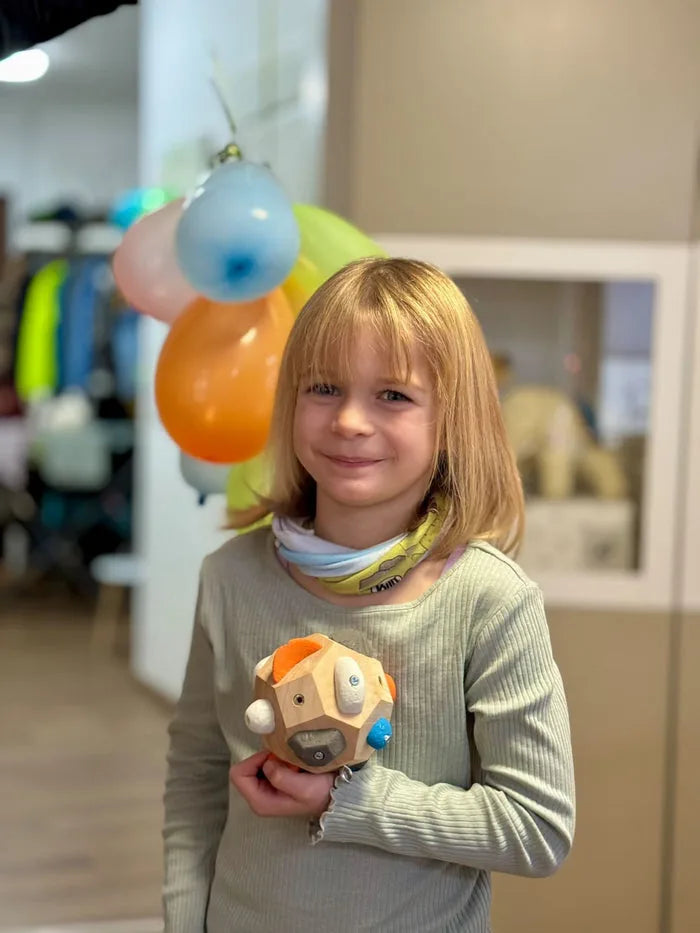 A young girl holding her Boulder Block
