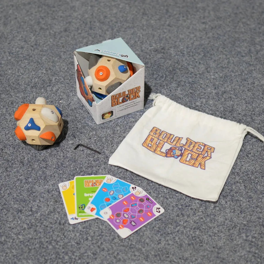 The Boulder Block, its box, a drawstring bag, the Allen wrench and Challenge Deck route cards